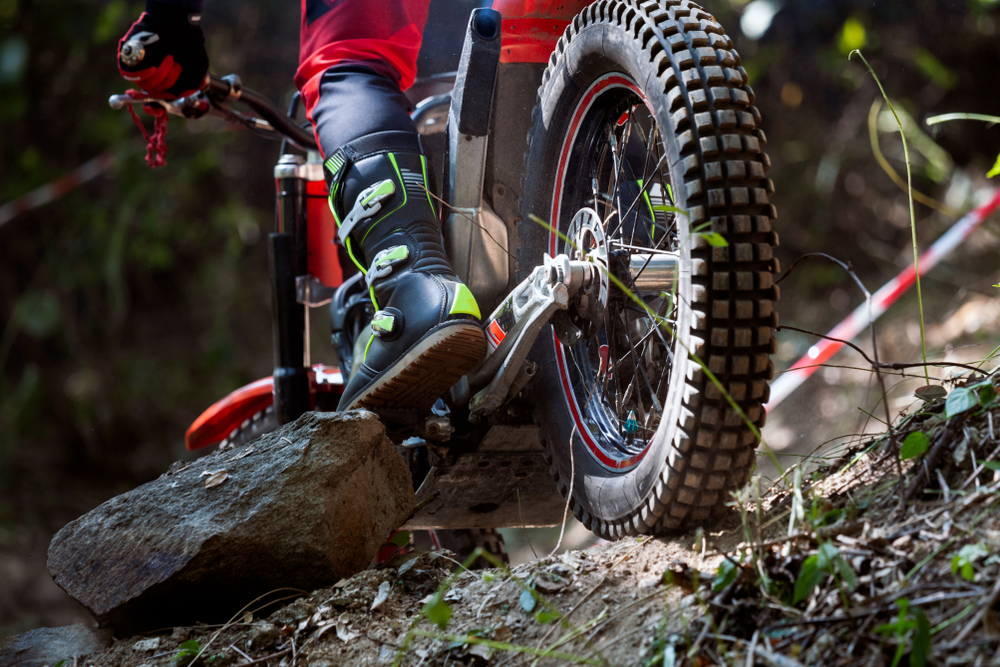Trials,Motorcycle,While,Competition,In,Nature,Park,,Close,Up,Shot